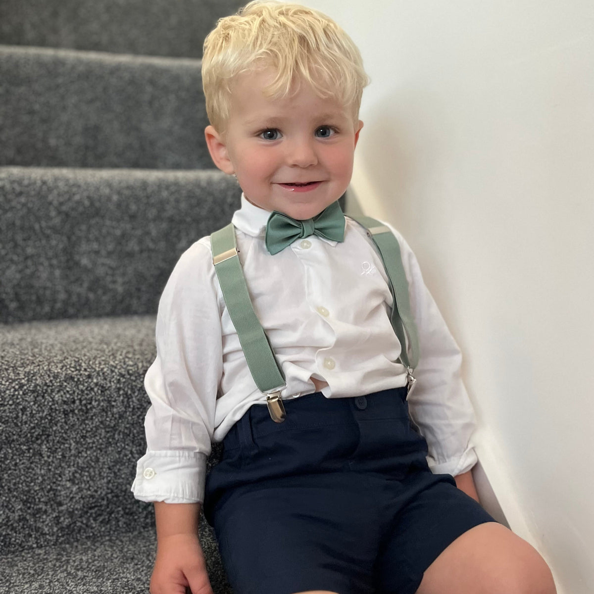 green bow tie and braces