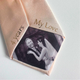 A champagne necktie with custom printed text reading '4 years' and 'My Love' surrounding a black-and-white wedding photograph of a couple